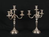 a pair of silver plated candelabs with four arms