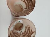 two cups that are sitting next to each other on a table
