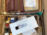 a cardboard box filled with assorted items in it