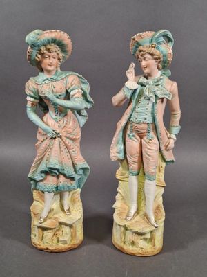 pair of porcelain figurines of a boy and a girl
