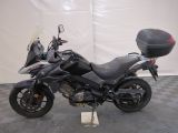 a picture of a motorcycle that is parked on a checkered floor