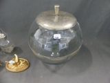 a glass jar with a lid sitting next to other items