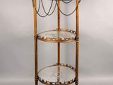 an image of a three tiered glass shelf on a white background