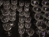 a lot of empty wine glasses sitting on a table