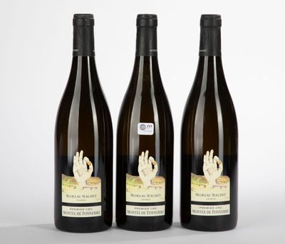 three bottles of wine sitting next to each other on a table