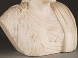 a white marble bust of a woman with a crown on her head