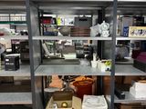 many shelves that have various items on them in the room