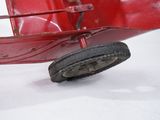 a red toy car that is sitting in the snow