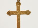 gold plated cross pendant with arabic calligraphy on a cord