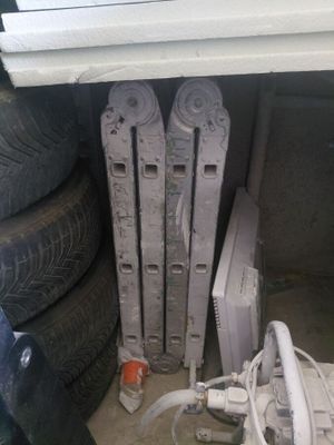 a radiator that is sitting next to a pile of tires