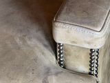 a close up of a couch with a pillow on it