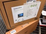 boxes are stacked on top of each other in a shopping cart