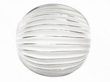 a glass ball that is sitting on a white surface