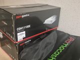 a black bag sitting on top of a stack of boxes