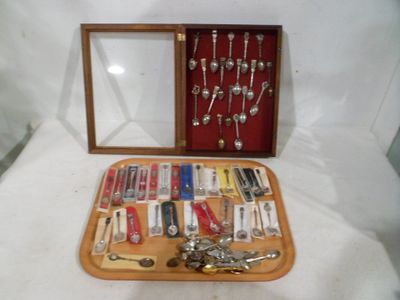 a wooden box with a variety of silverware in it