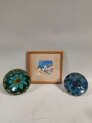two glass bowls and a framed picture of a beach scene