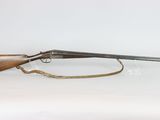 a rifle with a wooden barrel on a white background