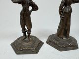 pair of antique bronze figurines of a woman and a man