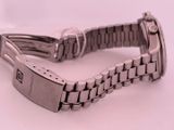 a close up of a watch on a white surface