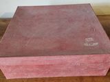 a pink box sitting on a wooden table