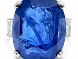 an oval blue sapphire ring set in white gold with diamonds
