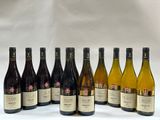 several bottles of wine are lined up in a row on a white background