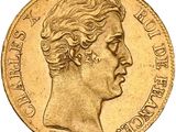 a close up of a gold coin with a woman ' s face