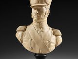 a carved bust of a man wearing a military uniform