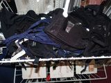 a basket full of clothes and a bag in it