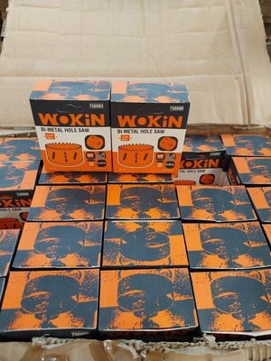 several boxes of orange and blue boxes of wax on a table