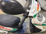 a close up of a motor scooter with a helmet on it