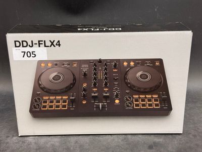 a close up of a dj controller in a box on a table