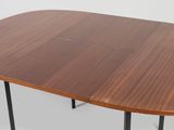 a close up of a table with a wooden top and metal legs