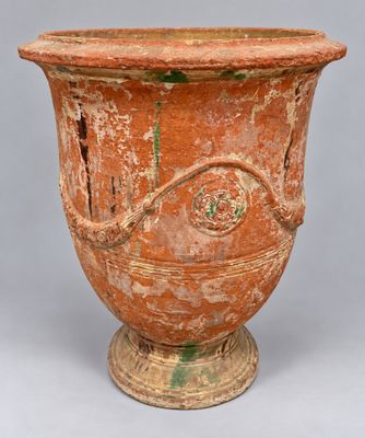 an image of a very old looking vase on a gray background