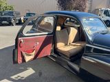 a car that is parked in a parking lot with its door open