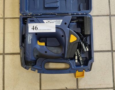 a blue tool box with tools in it on a tiled floor