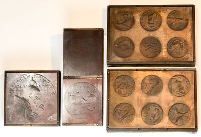 several different types of coins are displayed on a white surface