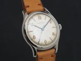 an image of a close up of a wrist watch with a brown leather strap