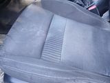 an image of a car seat with a dirty seat cover