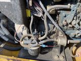 a close up view of the engine of a construction vehicle