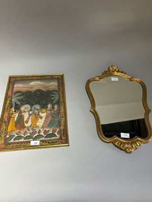 two mirrors on the wall next to each other
