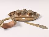 a gold plate with a knife and a spoon on it