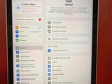 someone is holding a tablet with a menu on the screen