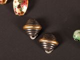 some beads that are sitting on a black surface