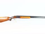 a shotgun with a wooden barrel and a wooden handle