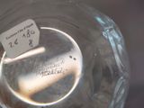 a glass jar with a cigarette in it with a label on it