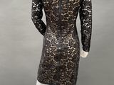 the back of a mannequin dress with black lace on it