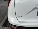 a white car parked on the side of the road