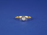 an engagement ring with a diamond on a blue background