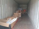 many boxes in the back of a shipping container